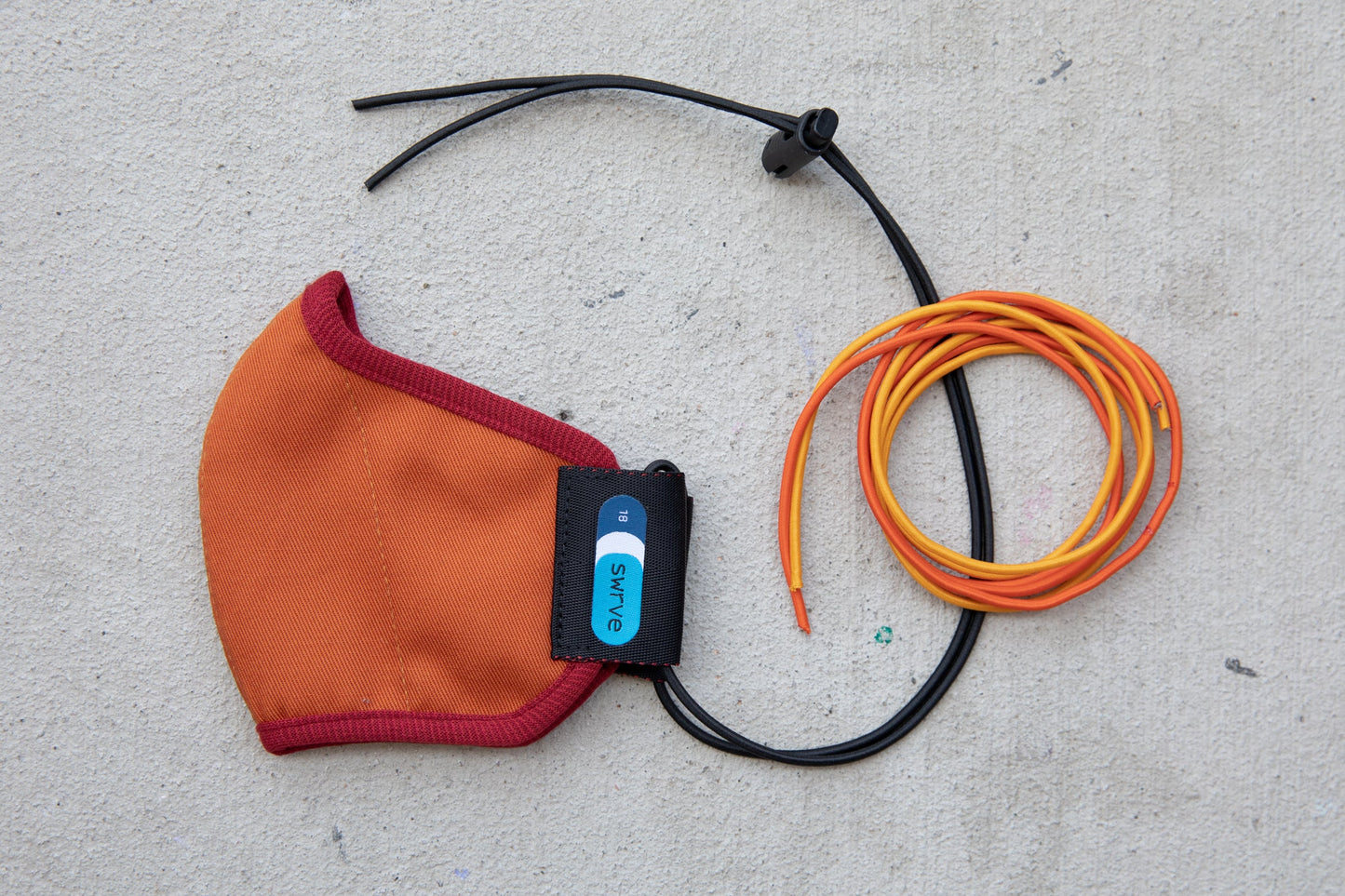 flat shot of the abby's kids summer cotton mask in leaf pile