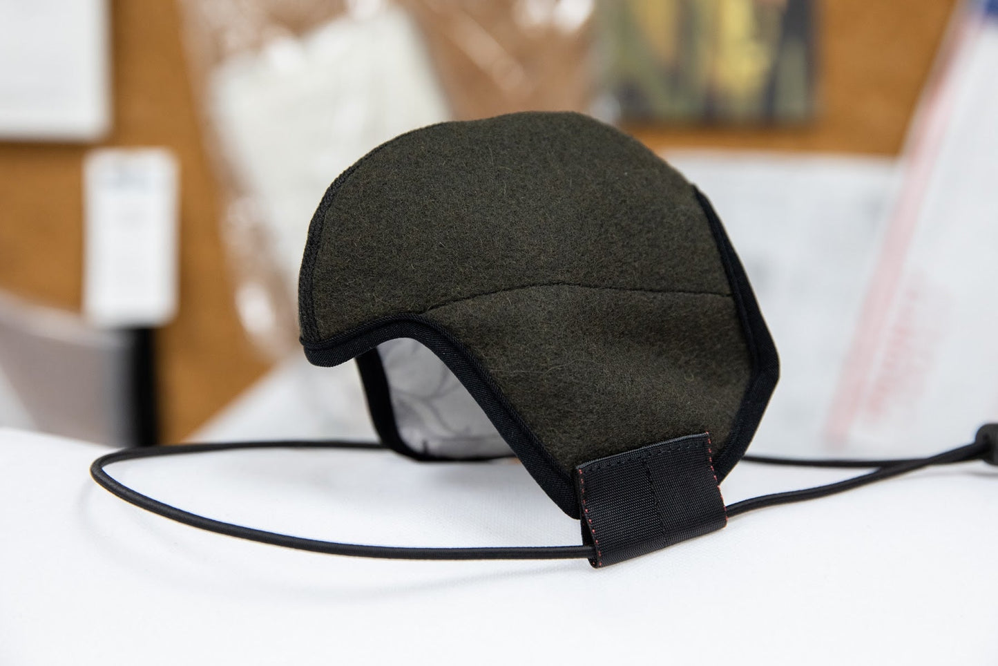 side shot of the 3 layer green felted wool mask in the adult fit