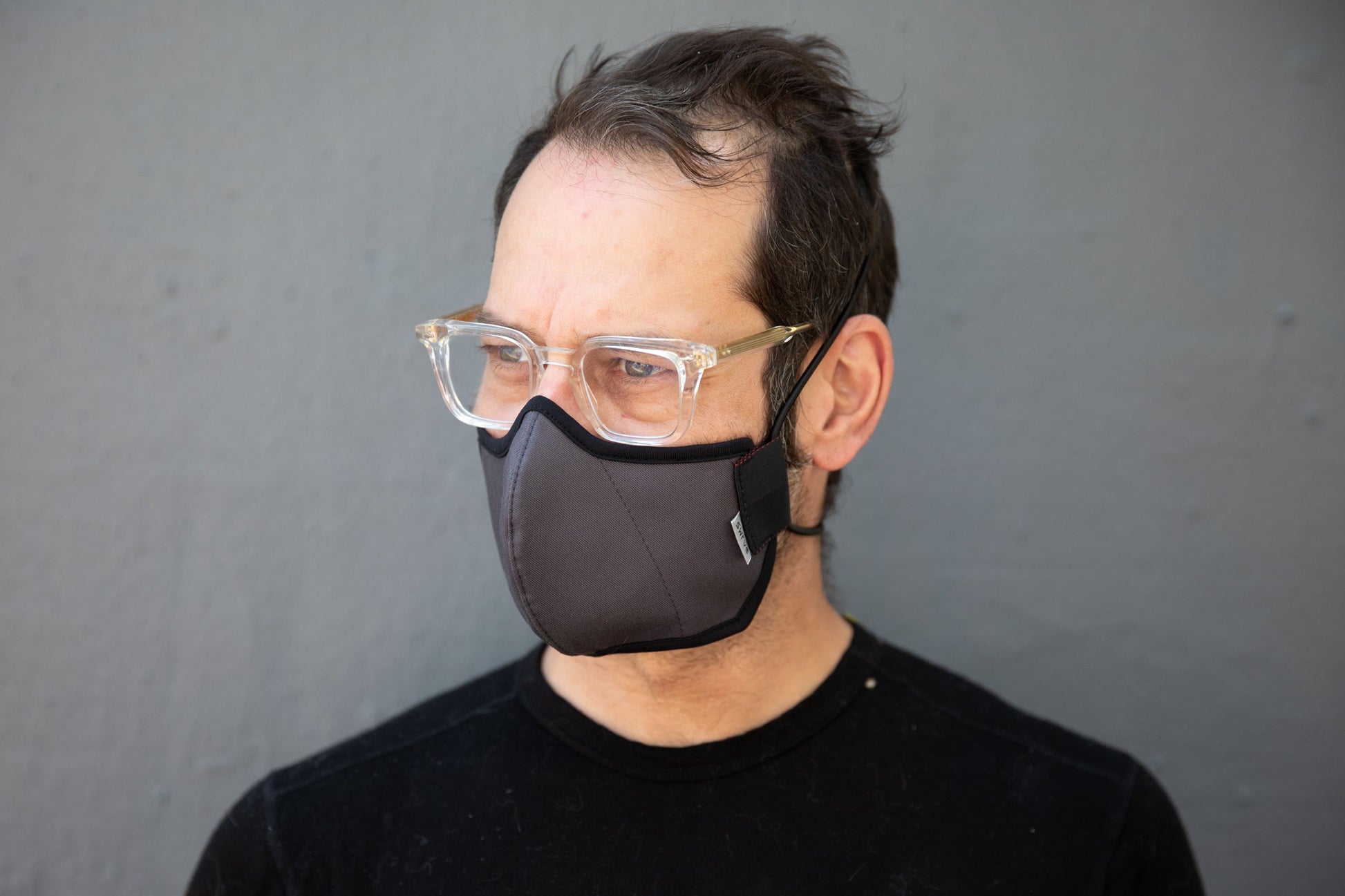 Matt is wearing the organic summer cotton mask in dark grey