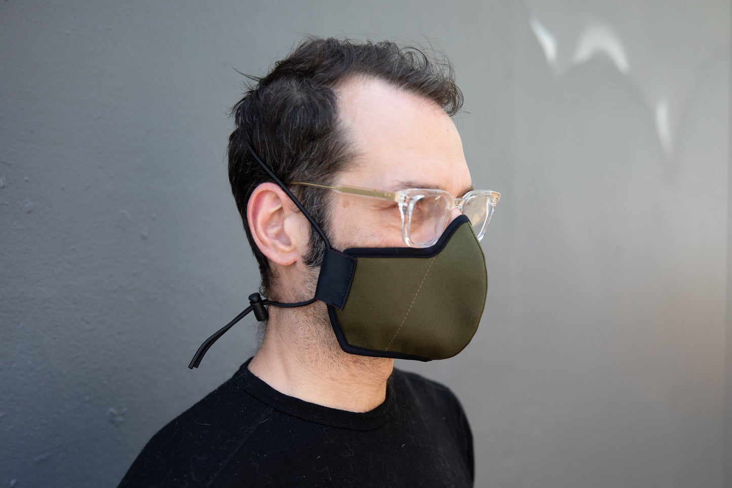 Matt is wearing the organic summer cotton mask in olive