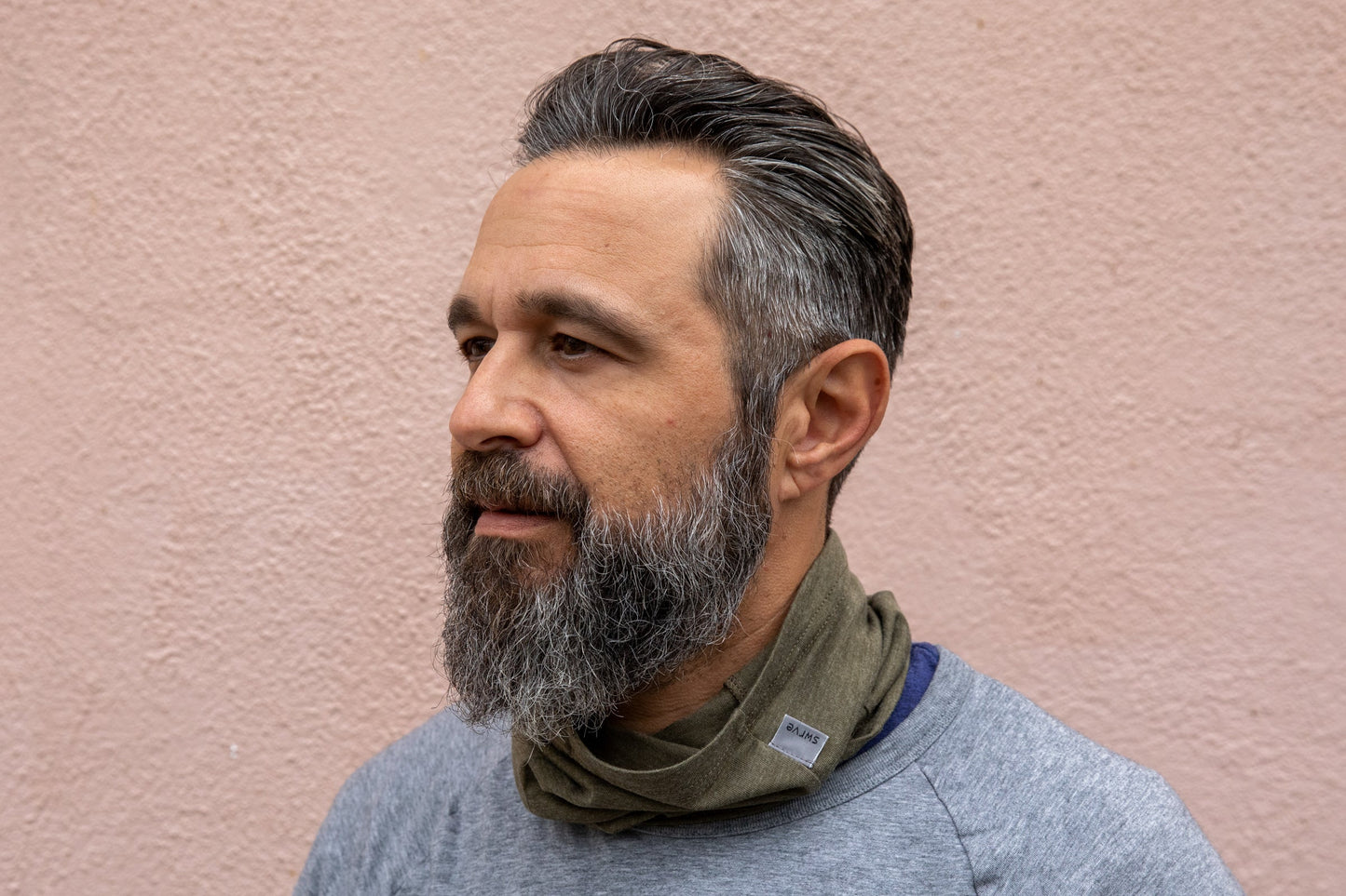 a model wearing the heather pine neck gaiter