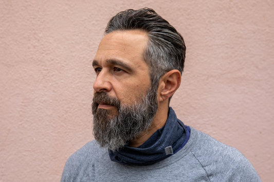 a model wearing the heather navy neck gaiter