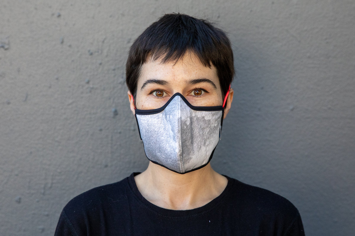 roxy is wearing the black & white cotton mask in rain storm