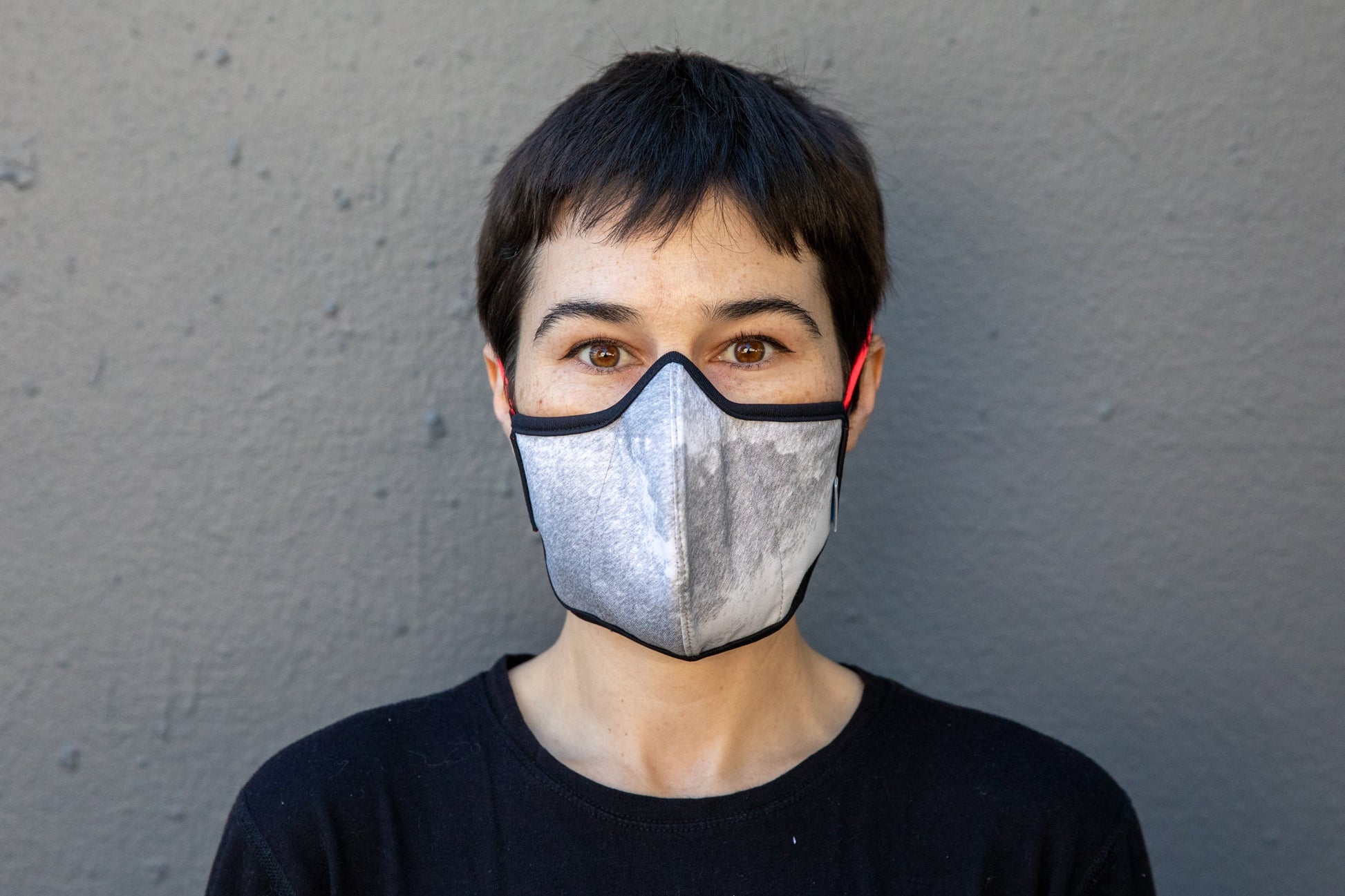 roxy is wearing the black & white cotton mask in rain storm