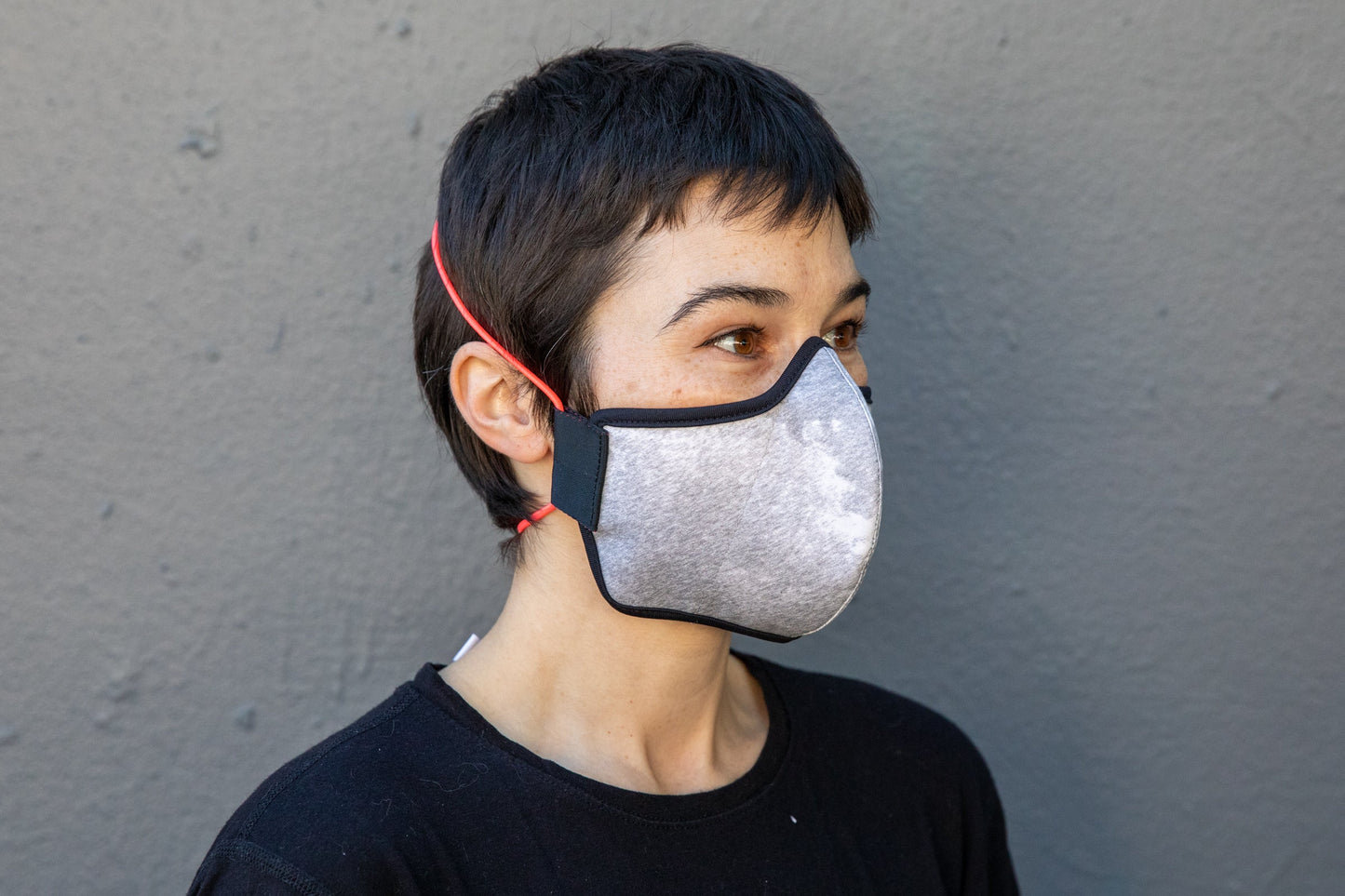 roxy is wearing the black & white cotton mask in rain storm