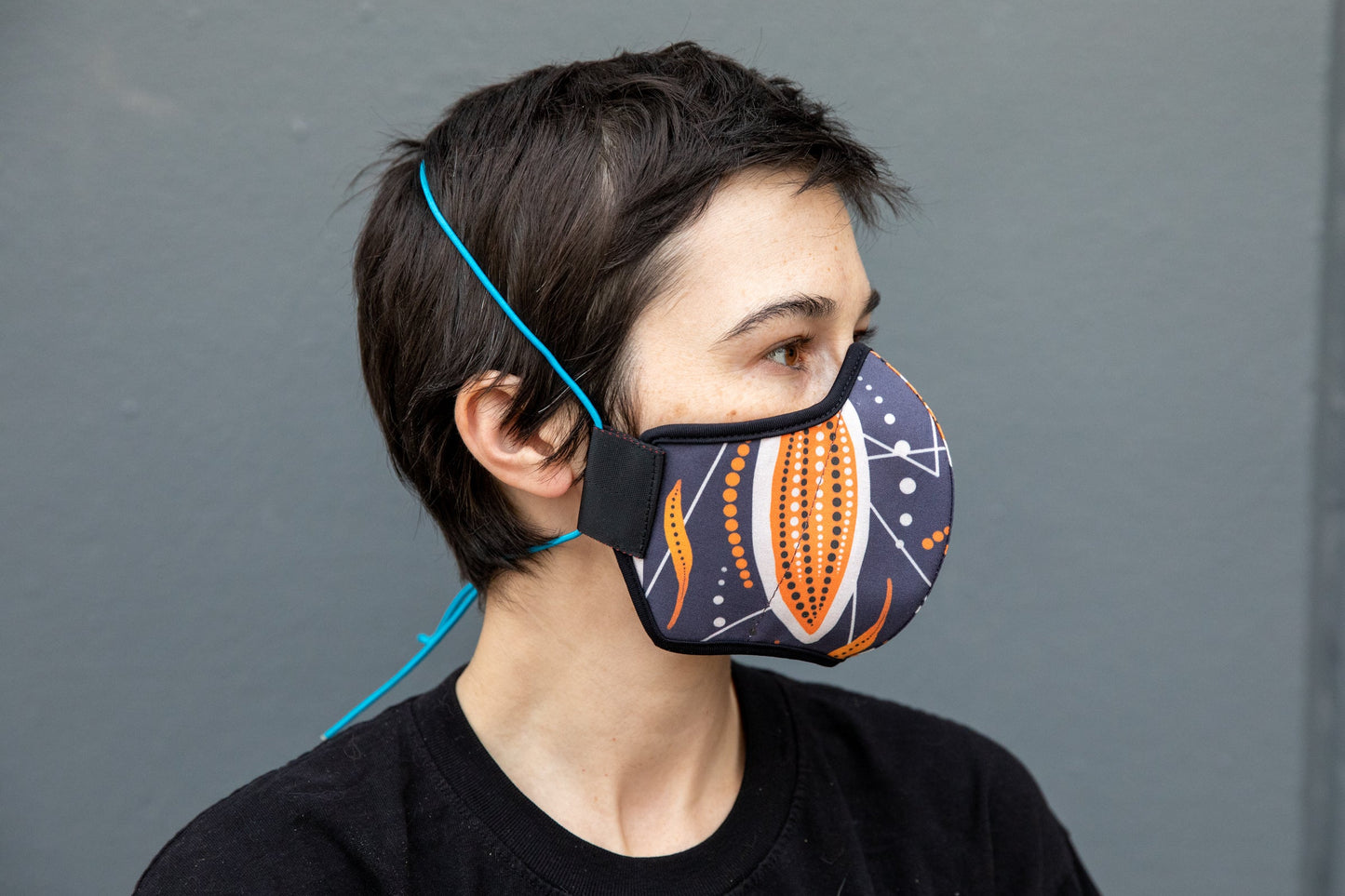 Roxy wearing the African cotton mask in cocoa pod in the adult fit