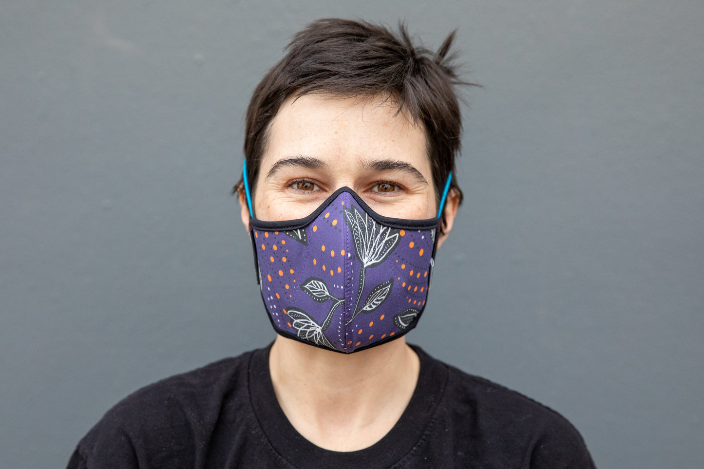 Roxy wearing the African cotton mask in night flowers in the adult fit