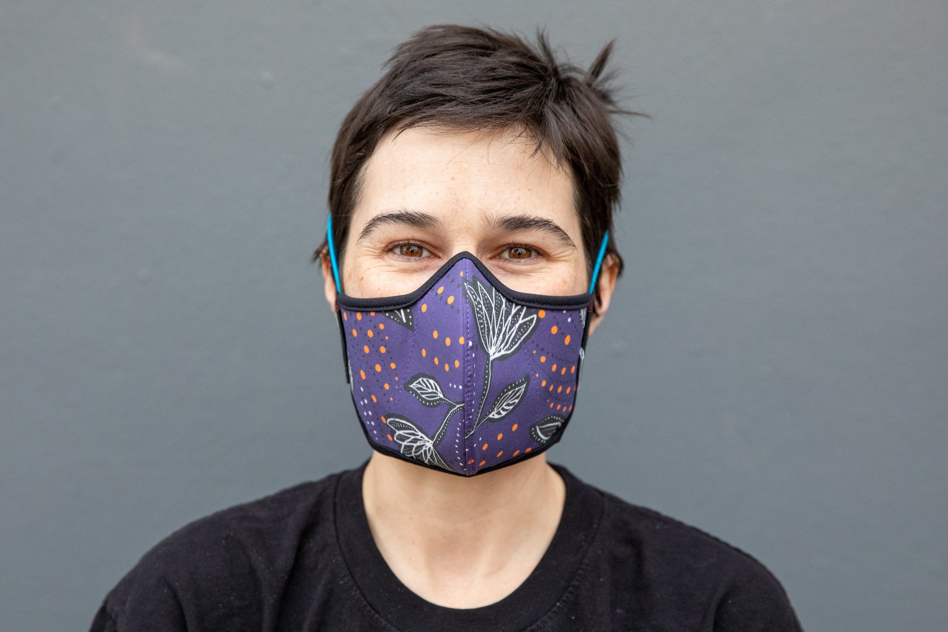 Roxy wearing the African cotton mask in night flowers in the adult fit