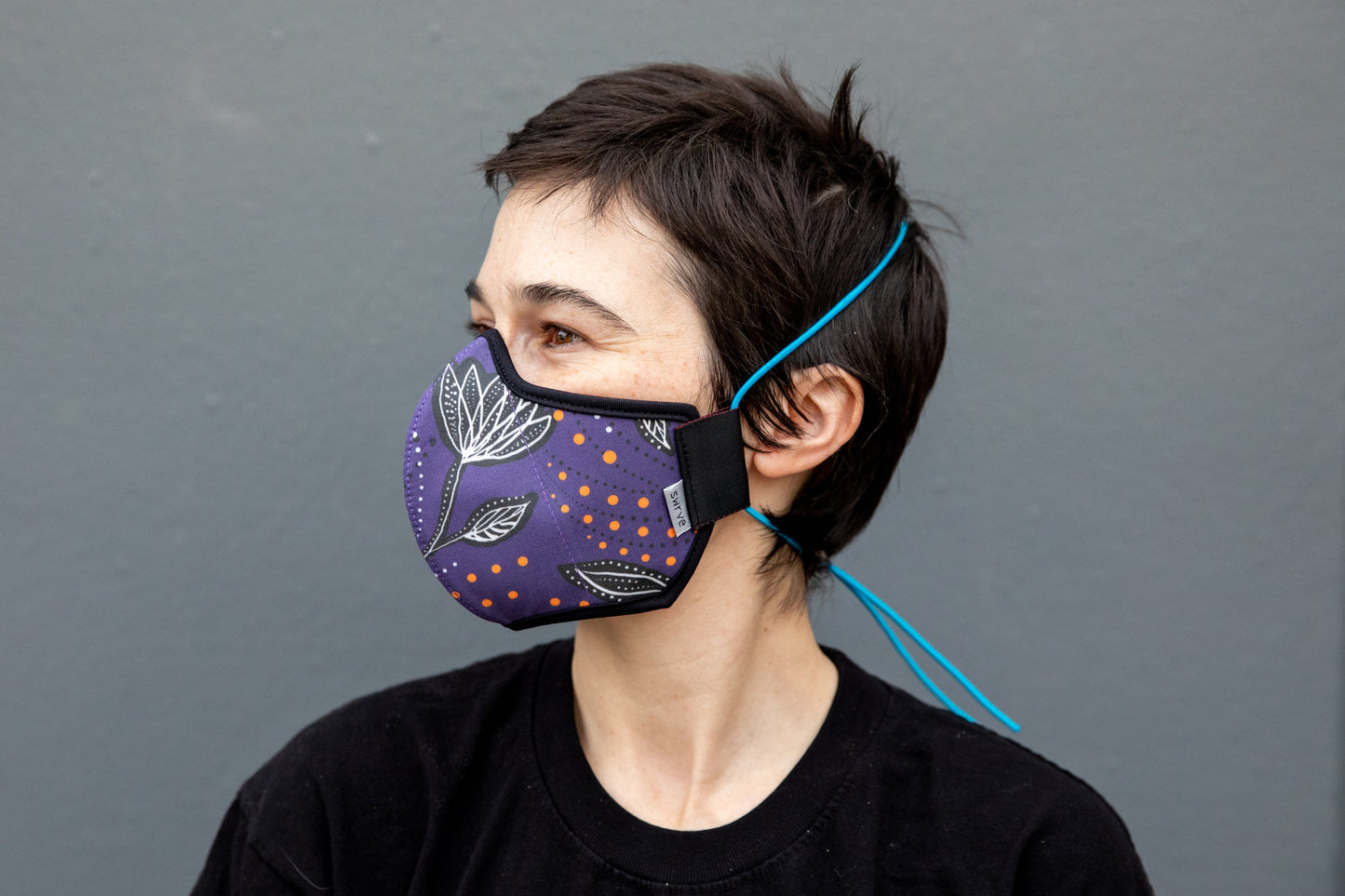 Roxy wearing the African cotton mask in night flowers in the adult fit