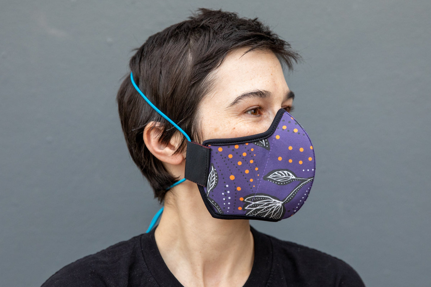 Roxy wearing the African cotton mask in night flowers in the adult fit