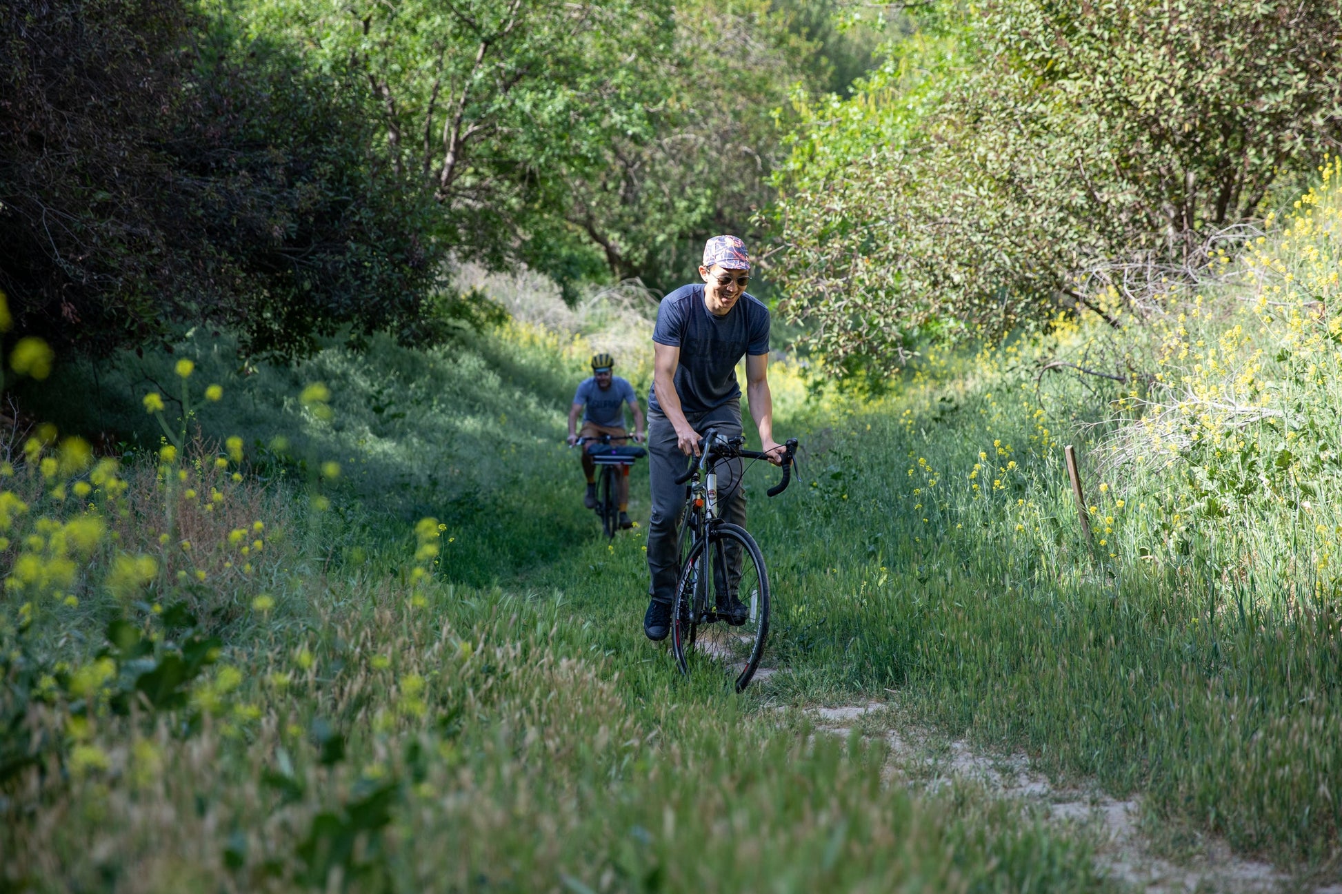 Teddy cycling in USA super soft tri-blend 1968 swrve logo t-shirt in heather navy.