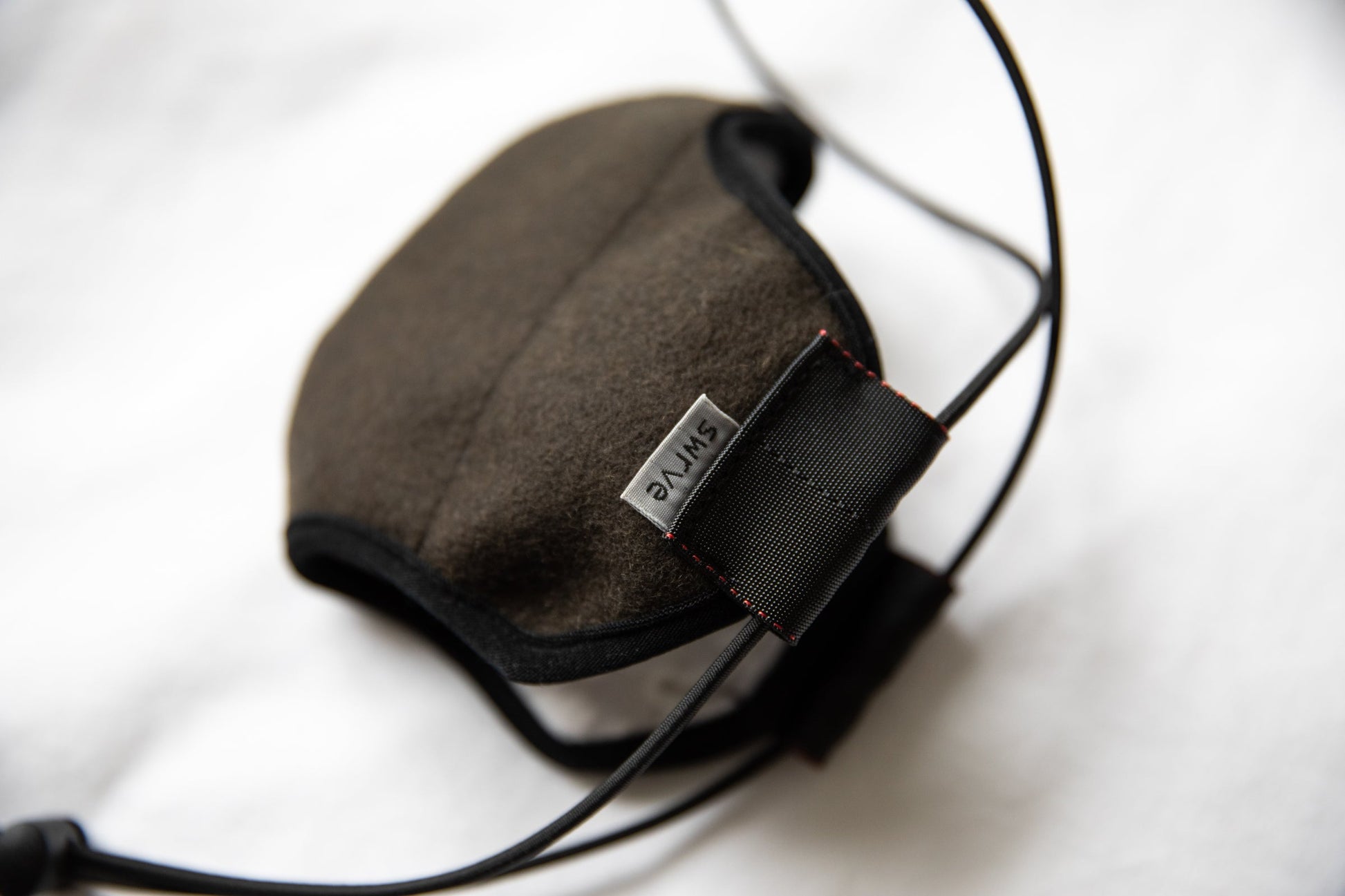 side shot of the 3 layer green felted wool mask in the adult fit