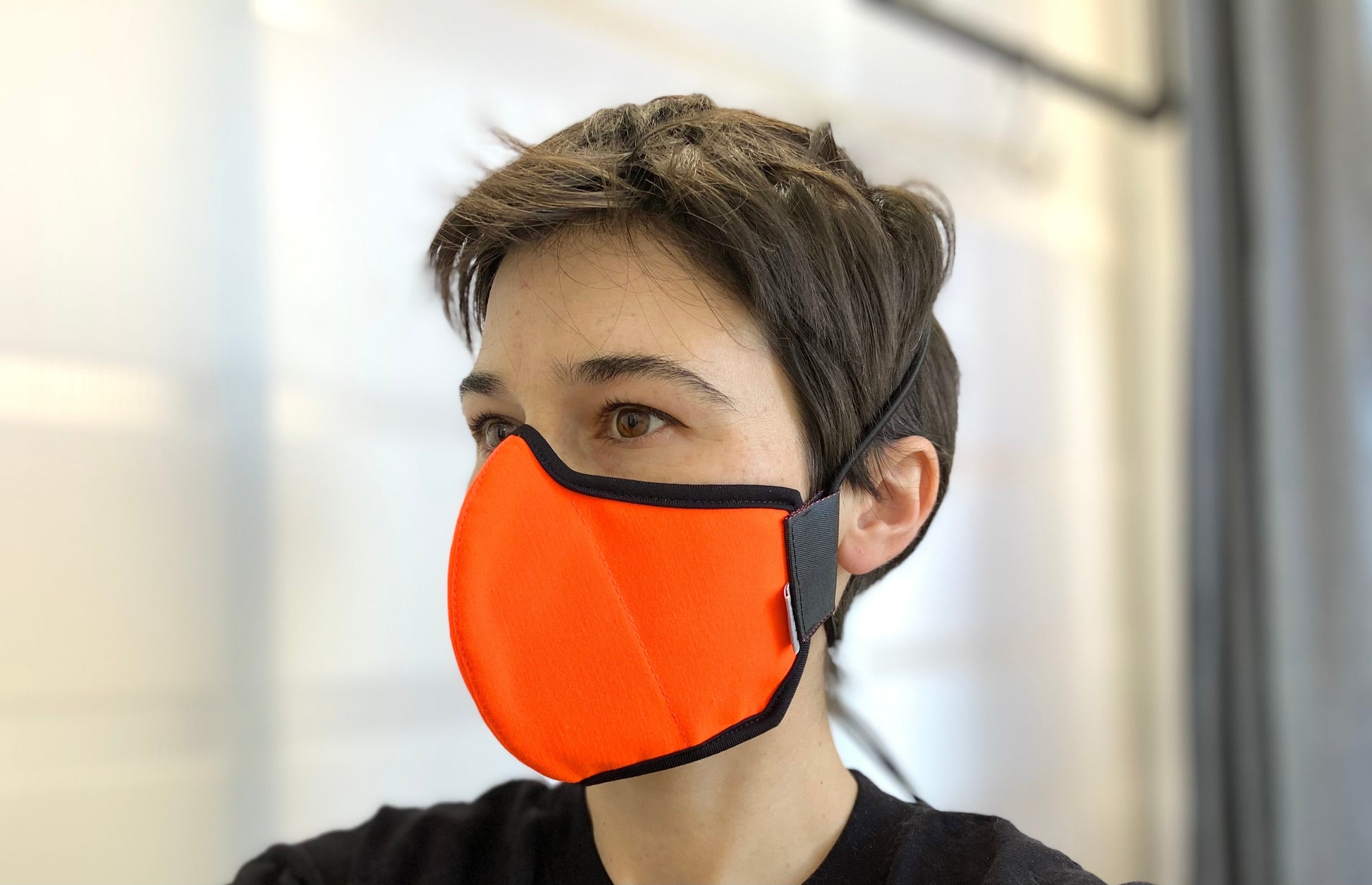 roxy is wearing the fluorescent orange mask.