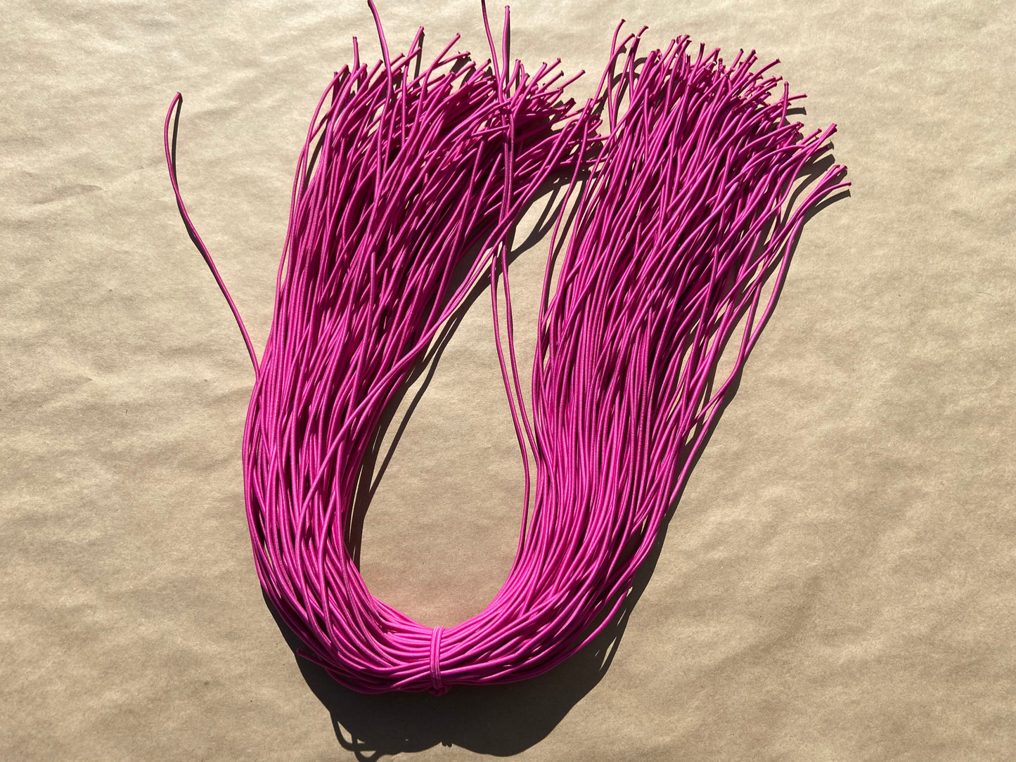 flat shot of our mask color cord in fuchsia