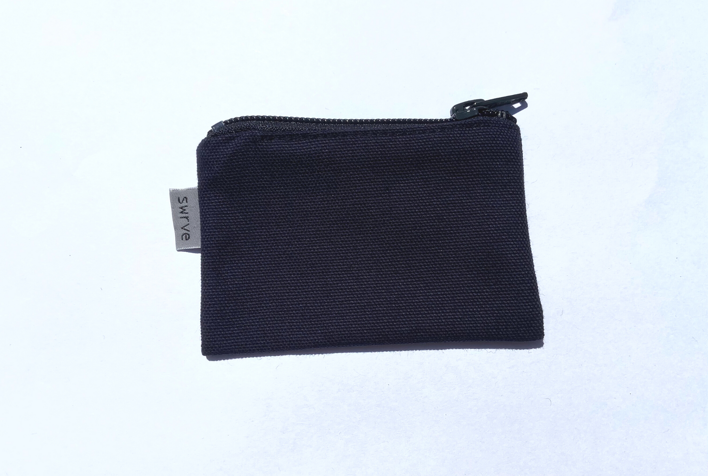 navy bolsita with grey ykk zipper