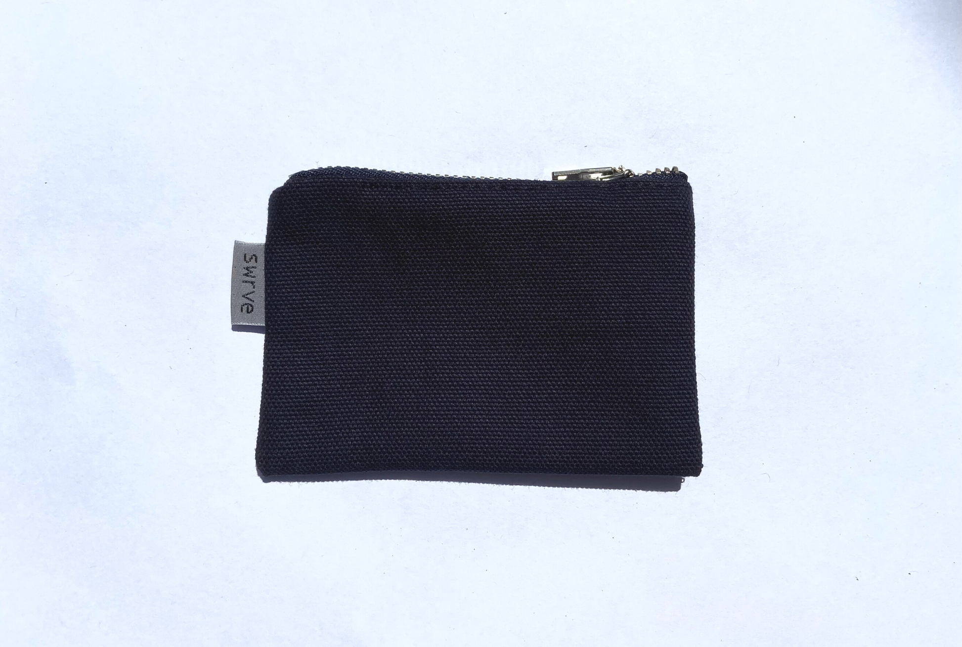 navy bolsita with silver ykk zipper