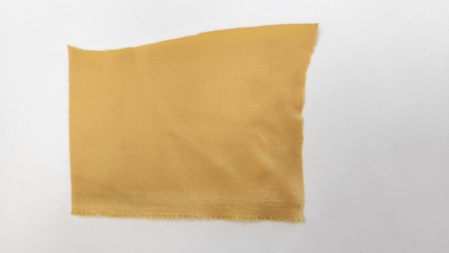 Maize yellow Schoeller fabric square on a white background